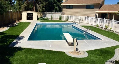 Artificial turf with pool in backyard