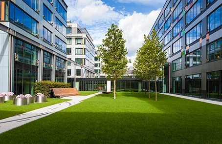 Office buildings surrounding commercial landscaping.