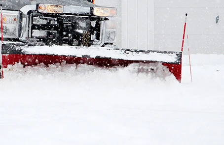 Plow truck removing snow grounds guys emergency.